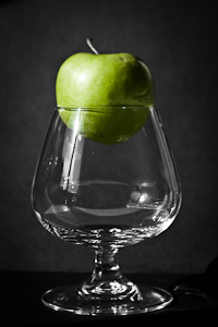 Glass with green apple