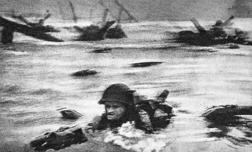 Robert Capa. FRANCE. Normandy. June 6th, 1944. Landing of the American troops on Omaha Beach.