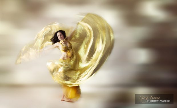 Ethereal beautiful woman swirling in a dance move