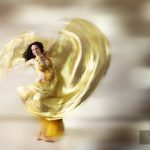 Ethereal beautiful woman swirling in a dance move