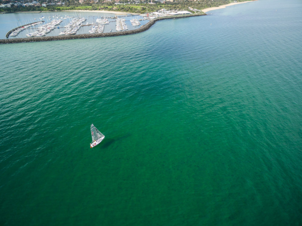 Aerial image of boat sailing near Sandringham Marina. Melbourne, Victoria, Australia