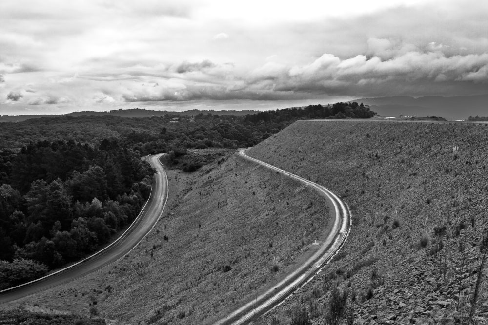 Winding road on the Cardinia Reservoir dam wall in Melbourne, Australia